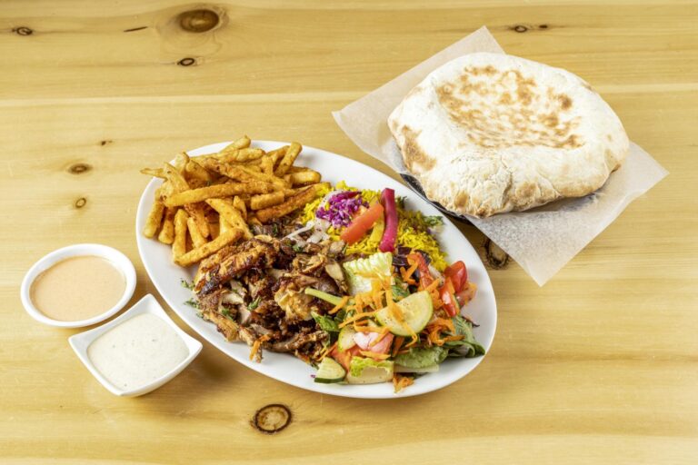 Chicken shawarma platter with rice, fries, salad and bread