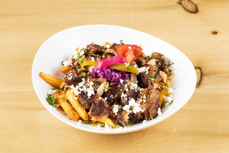 Gus In The Box with chicken shawarma, fries and feta
